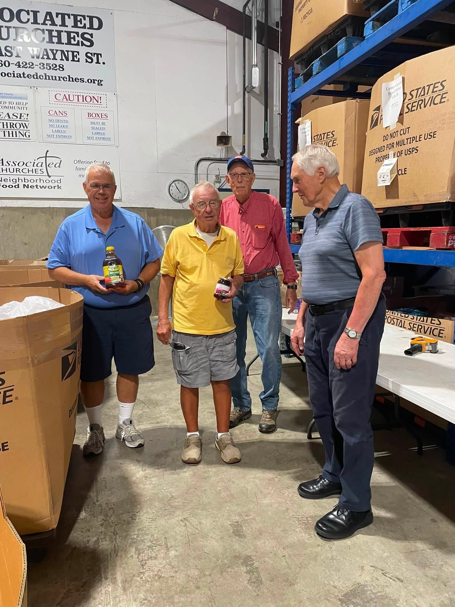 Chapter members packing donated food at the Associated Churches of Fort Wayne volunteer event